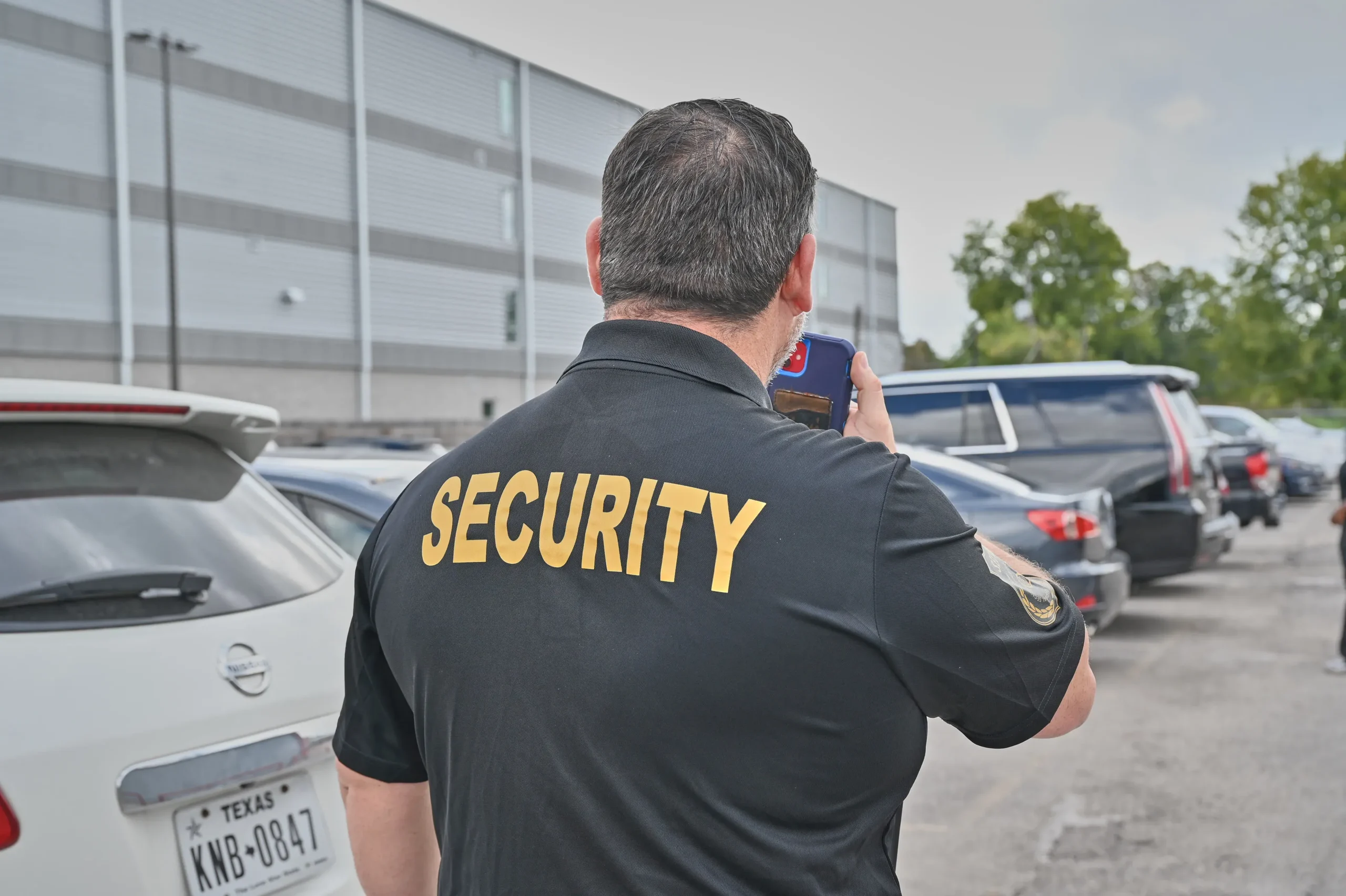 Security personnel and executives collaborating on risk assessment strategies in a conference environment.