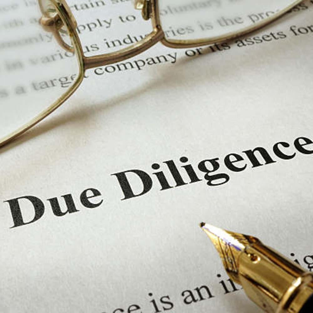 Private investigator analyzing financial documents for fraud detection
